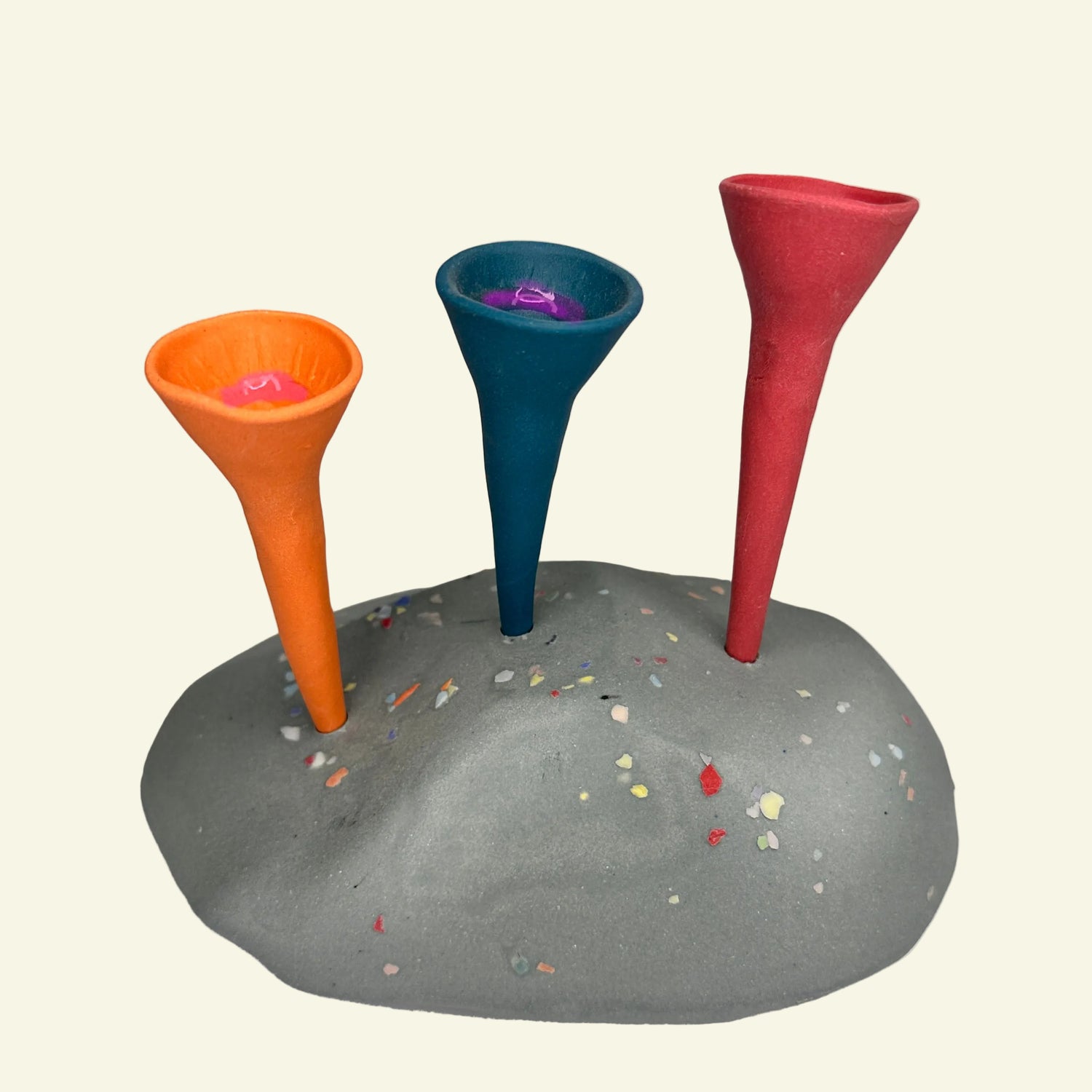 Three colorful Bee Cups watering stations in a gray holder